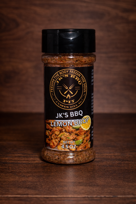 JK’s BBQ Lemon Drop seasoning 4.5 oz bottle on wooden background with citrus BBQ rub blend visible in clear jar