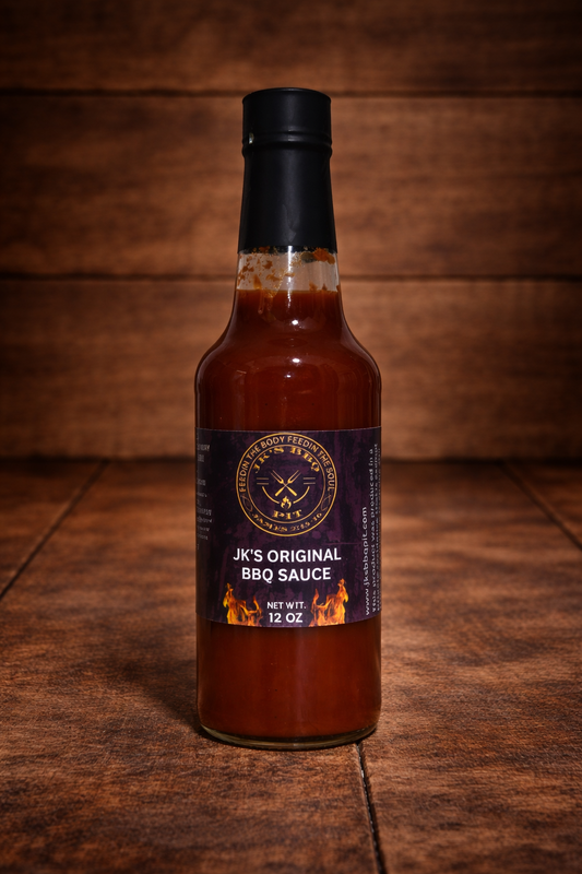 JK’s Original BBQ Sauce 12 oz bottle on rustic wooden table background – classic pitmaster BBQ sauce from JK’s BBQ Pit.
