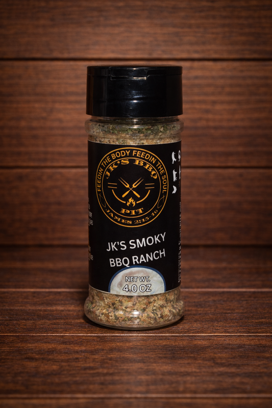 JK's Smoky BBQ Ranch seasoning 4 oz bottle on rustic wooden table and wood wall background – smoky ranch BBQ rub for burgers, chicken, fries, and grilling