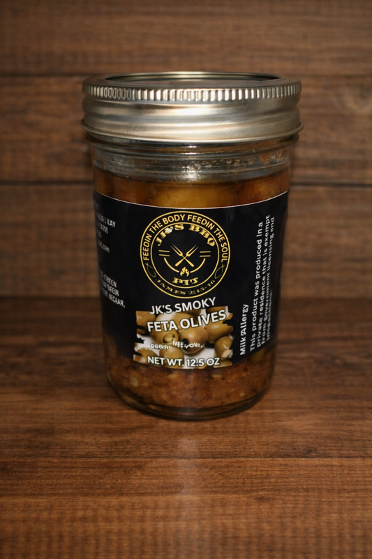 Smoky feta stuffed olives by JK's BBQ Pit in 12.5 oz jar on rustic wood background gourmet charcuterie olive snack