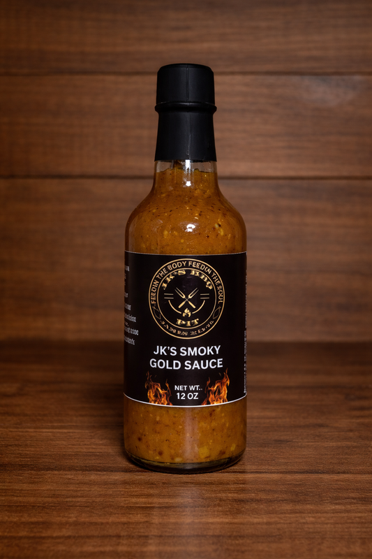 12 oz bottle of JK's BBQ Pit Smoky Gold BBQ Sauce on rustic wooden background Carolina gold style barbecue sauce