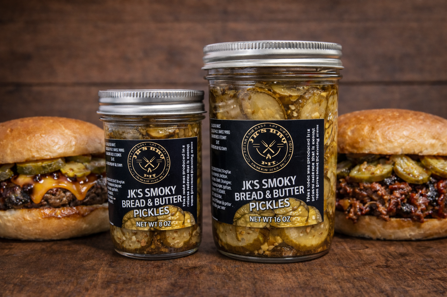 JK’s Smoky Sweet Heat Pickles bread and butter style smoked BBQ pickles in 8 oz and 16 oz jars served with burgers on a wooden table