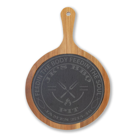 Wooden paddle with black engraved text on a white background
