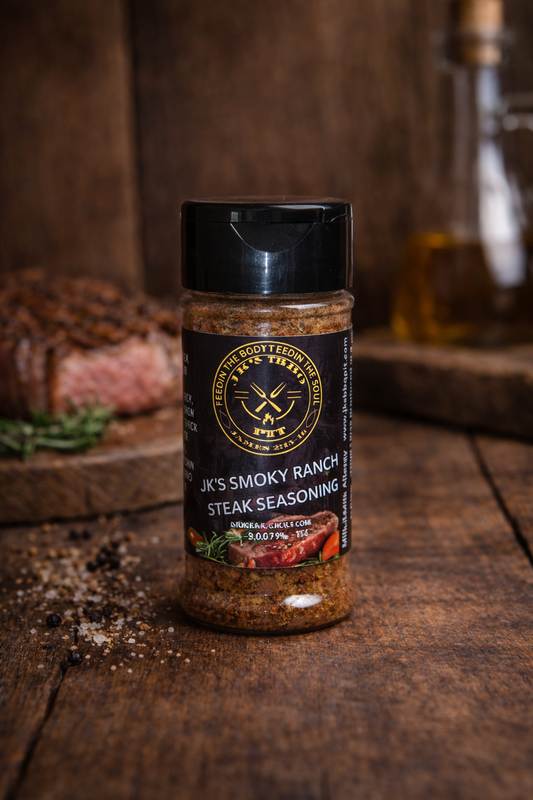 JK’s Smoky Ranch Steak Seasoning – small batch BBQ steak rub on wooden background with grilled steak and rosemary