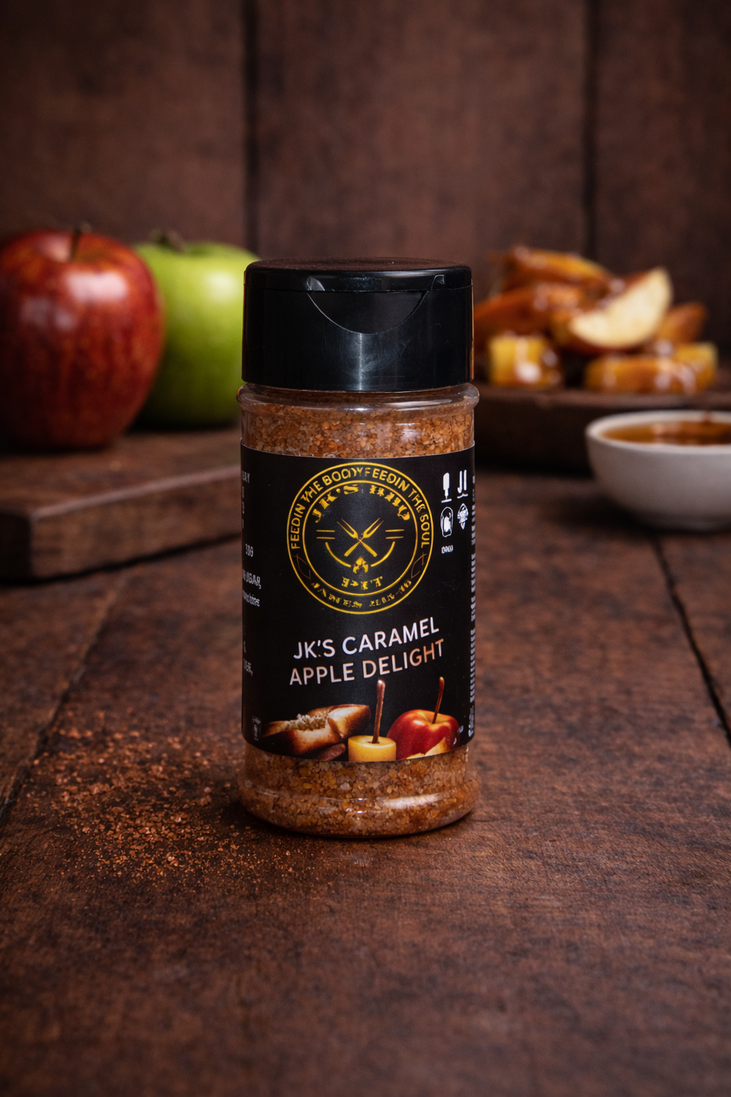 JK’s Caramel Apple Delight sweet seasoning for apples, desserts, baking, oatmeal, and fruit on rustic wood background
