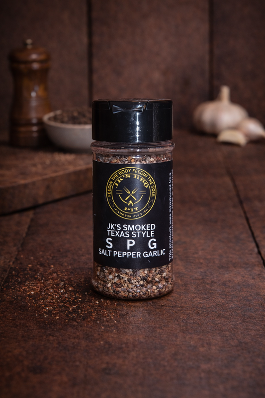 JK’s Smoked Texas Style SPG seasoning bottle with salt pepper garlic blend on rustic wood table
