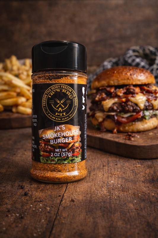 JK's BBQ Pit Smokehouse Burger seasoning bottle on a rustic wooden table with a juicy bacon cheeseburger and crispy fries in the background, highlighting a bold BBQ burger seasoning blend.
