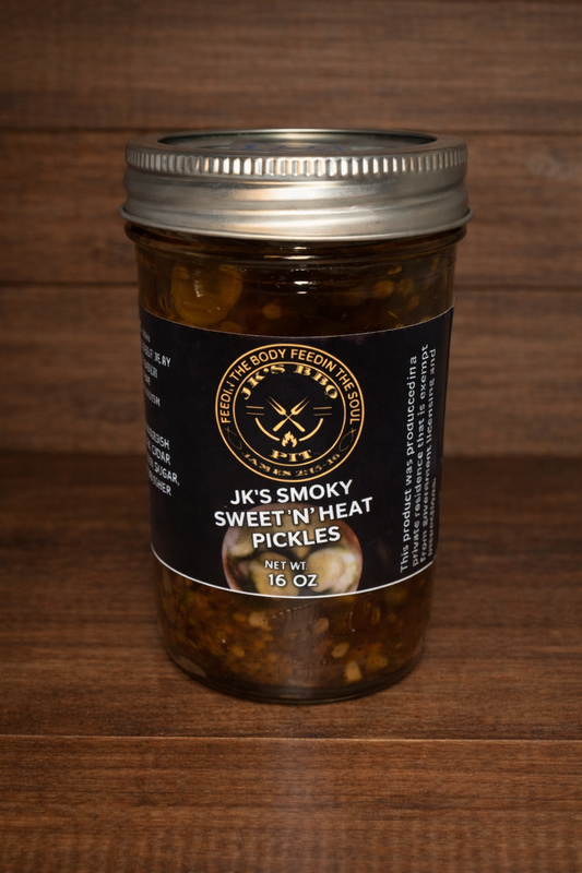 16 oz jar of JK's BBQ Pit Sweet N Heat smoked pickles on rustic wooden background gourmet sweet and spicy pickle slices