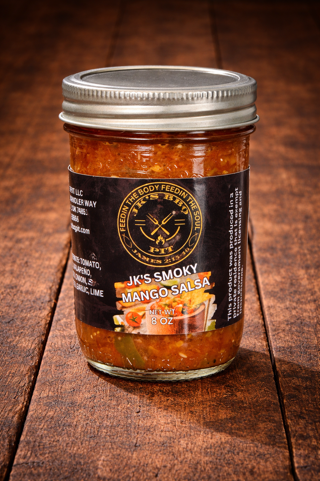 Jar of JK’s Smoky Mango Salsa on rustic wooden table background – sweet smoked mango salsa by JK’s BBQ Pit
