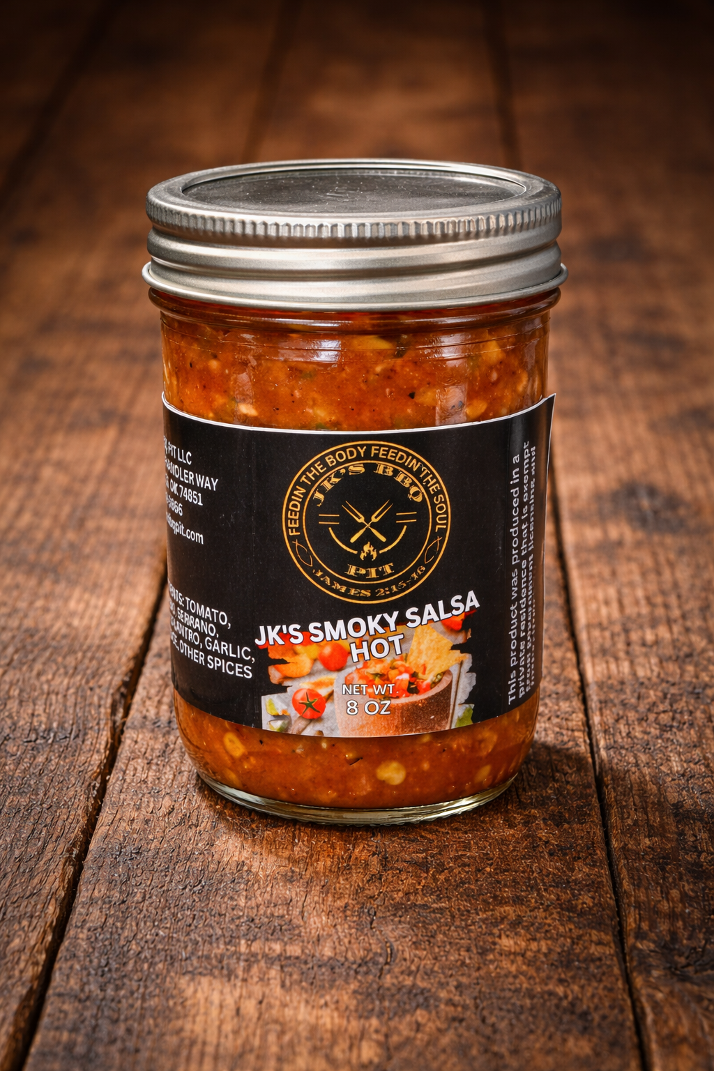Jar of JK’s Smoky Salsa Hot on rustic wood background – hot smoked salsa by JK’s BBQ Pit