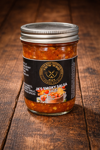 Jar of JK’s Smoky Salsa Hot on rustic wood background – hot smoked salsa by JK’s BBQ Pit
