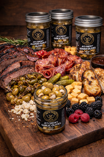 BBQ charcuterie board with smoked olives, brisket, cured meats, cheese, pickles and bread by JK’s BBQ Pit