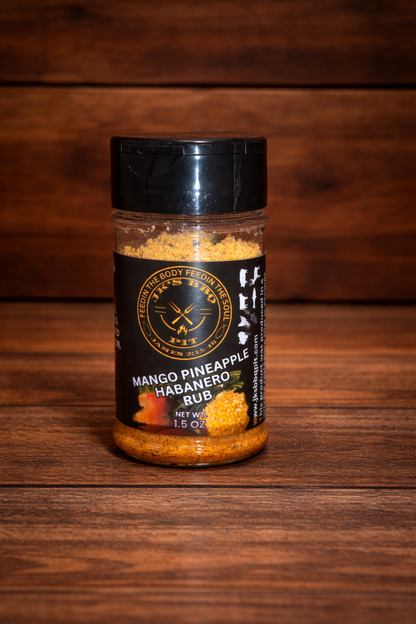 JK’s BBQ Pit Mango Pineapple Habanero Rub 1.5 oz seasoning bottle on rustic wooden background – sweet heat BBQ rub with mango, pineapple, and habanero peppers.