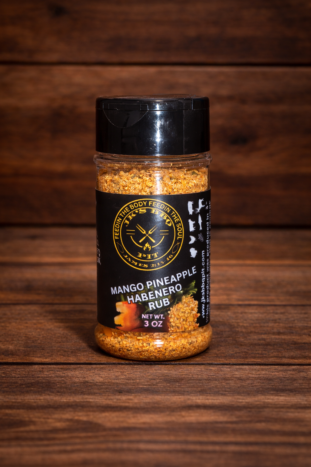 JK’s BBQ Pit Mango Pineapple Habanero Rub 3 oz seasoning bottle on rustic wooden background – sweet heat BBQ rub with mango, pineapple, and habanero peppers.