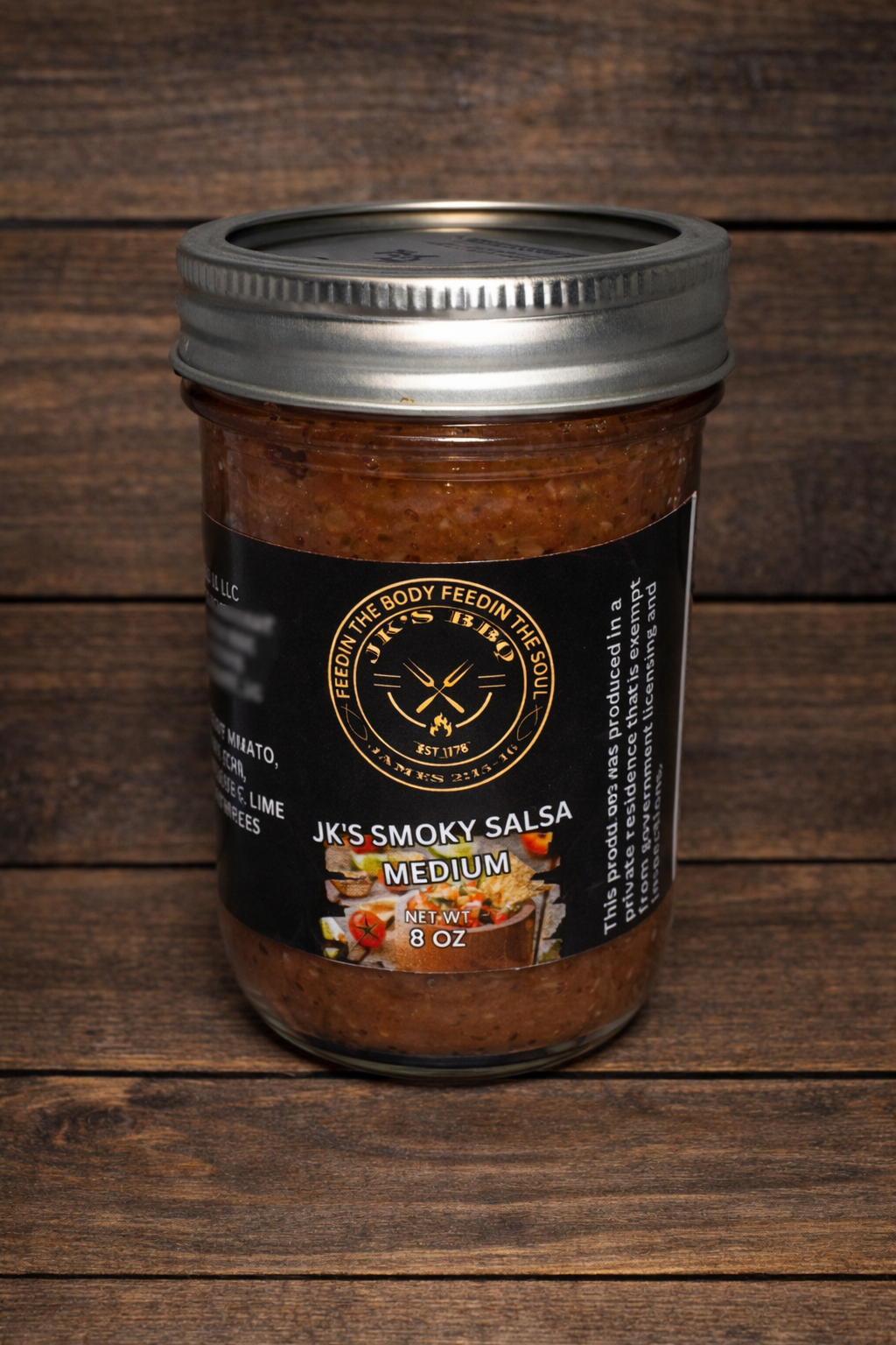 JK's BBQ Pit Smoky Salsa Medium 8 oz jar on rustic wooden background small batch smoked tomato salsa in mason jar