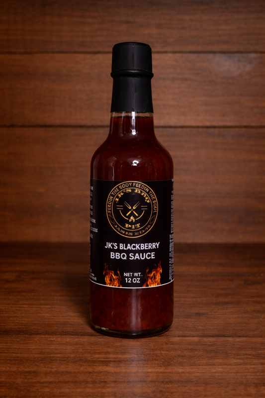 12 oz bottle of JK's BBQ Pit Blackberry BBQ Sauce on rustic wooden background sweet fruit infused barbecue sauce