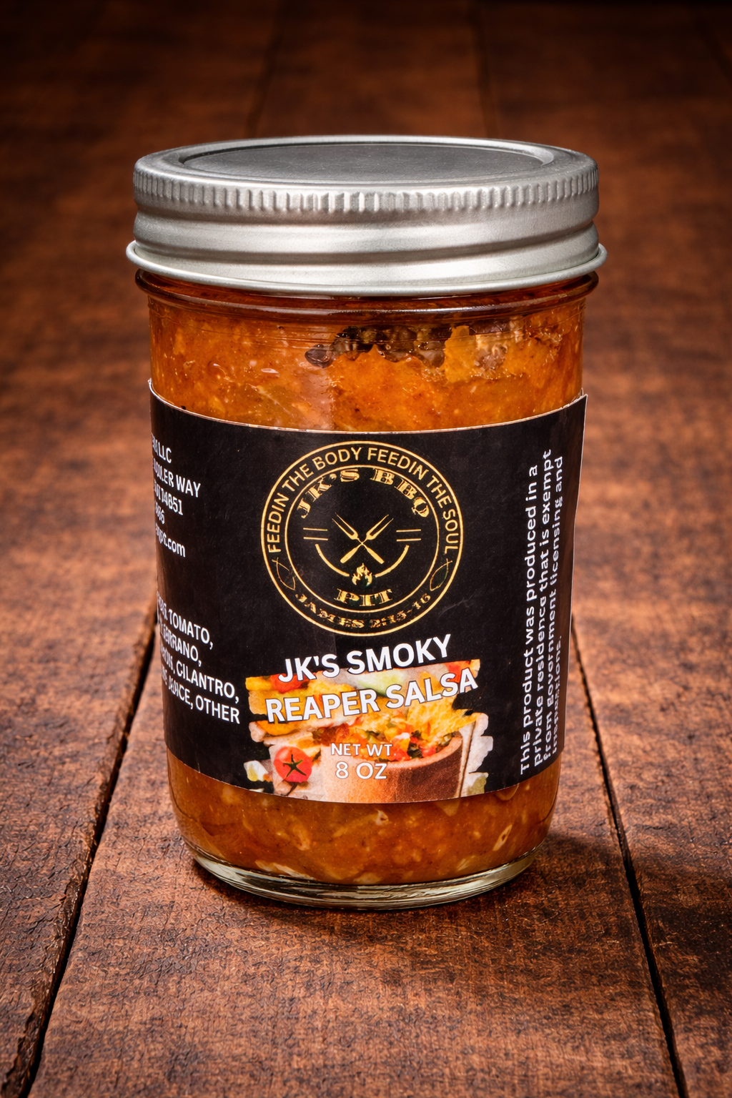 Jar of JK’s Carolina Reaper Smoked Salsa on rustic wooden background – extreme heat smoked salsa by JK’s BBQ Pit