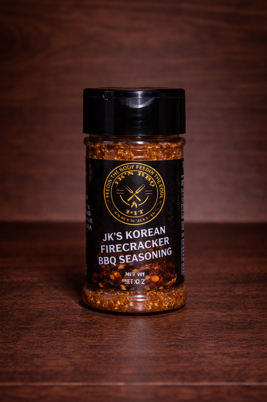 JK’s Korean Firecracker BBQ seasoning 2 oz bottle on wooden background with bold spicy Korean BBQ rub visible in clear jar