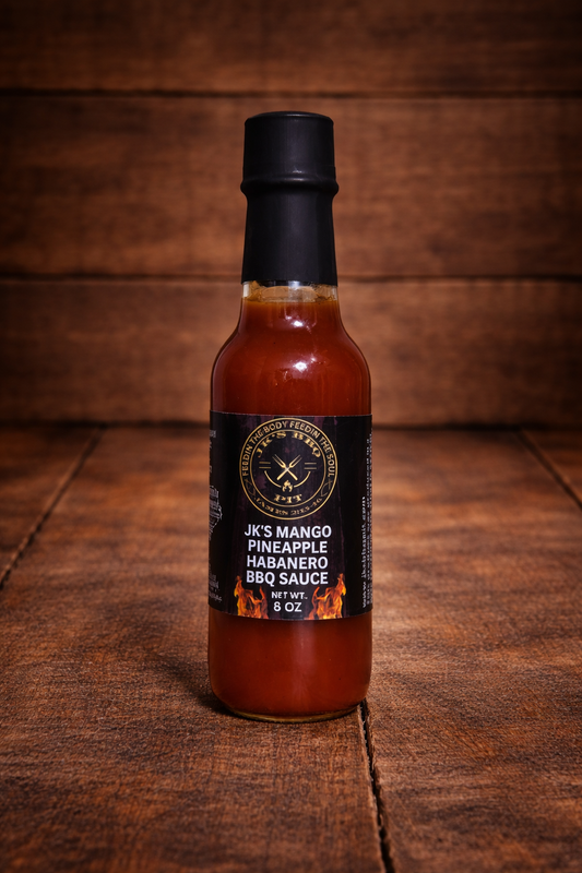 Bottle of JK’s Mango Pineapple Habanero BBQ Sauce on rustic wooden background – sweet heat tropical BBQ sauce by JK’s BBQ Pit