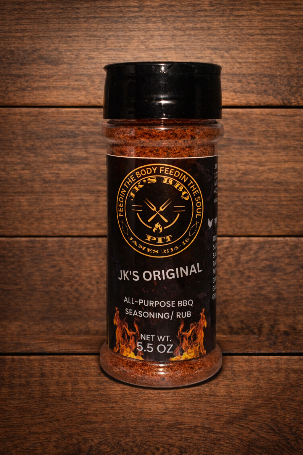 JK's Original All-Purpose BBQ Seasoning Rub 5.5 oz bottle from JK's BBQ Pit on rustic wooden table and wood wall background