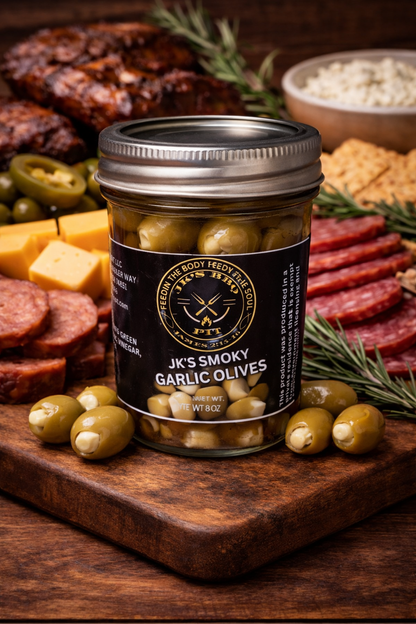 Smoked Garlic Olives by JK’s BBQ Pit with BBQ charcuterie board on rustic wooden table
