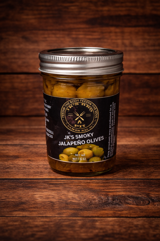 JK’s Smoky Jalapeño Olives jar on rustic wooden background