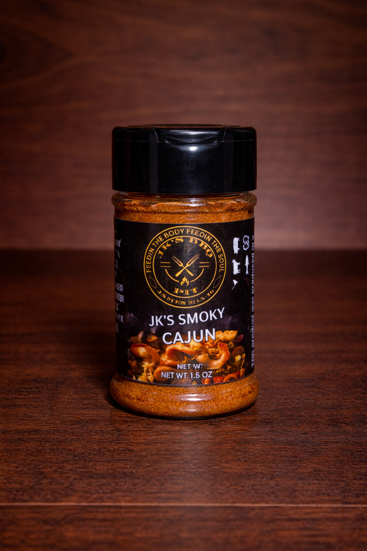 JK’s Smoky Cajun seasoning 1.5 oz bottle on wooden background with bold smoky Cajun spice blend visible in clear jar