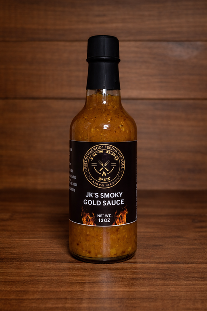 12 oz bottle of JK's BBQ Pit Smoky Gold BBQ Sauce on rustic wooden background Carolina gold style barbecue sauce
