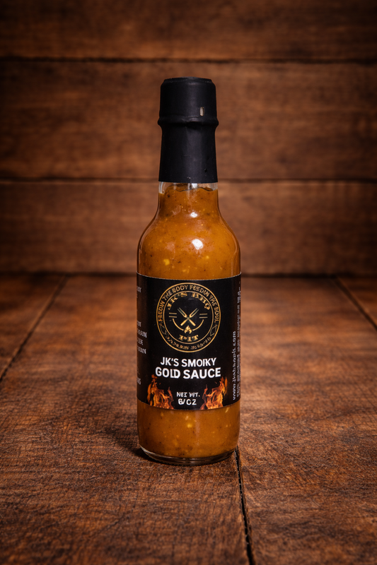 Bottle of JK’s Smoky Gold BBQ Sauce on rustic wooden background – small batch mustard style BBQ sauce by JK’s BBQ Pit
