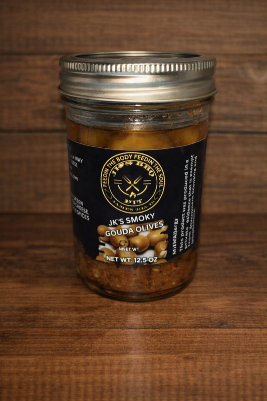 Smoky gouda stuffed olives by JK's BBQ Pit in 12.5 oz jar on rustic wood background charcuterie olive appetizer