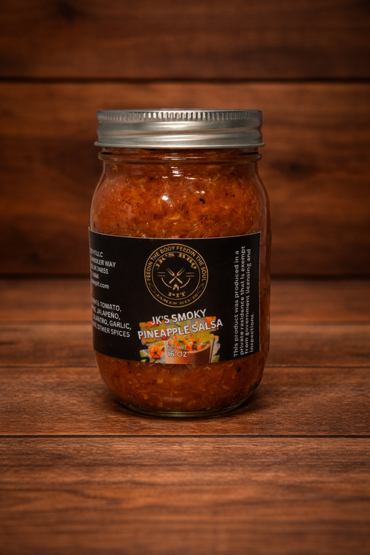 JK’s BBQ Pit Smoky Pineapple Salsa 16 oz jar on rustic wooden background – sweet smoky pineapple salsa perfect for BBQ meats, tacos, nachos, and chips.