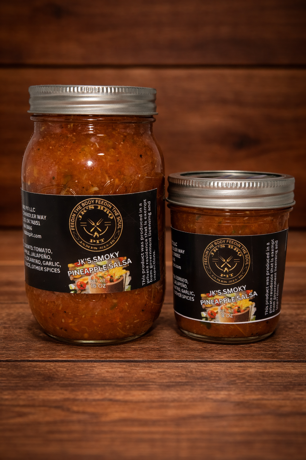 JK’s BBQ Pit Smoky Pineapple Salsa jars showing 8 oz and 16 oz sizes on rustic wooden background – sweet smoky pineapple salsa for BBQ meats, tacos, nachos, and chips.