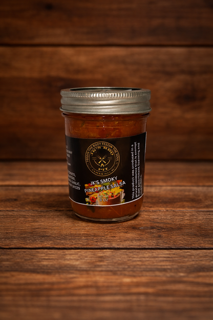 JK’s BBQ Pit Smoky Pineapple Salsa 8 oz jar on rustic wooden background – sweet smoky pineapple salsa for BBQ, chips, tacos, and grilled meats.