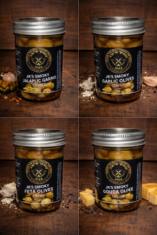 Smoked olive variety pack with jalapeño garlic, garlic, feta and gouda olives in jars on rustic wooden background by JK’s BBQ Pit